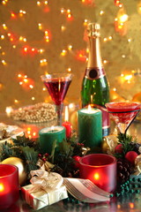 Christmas decoration with candle light and red wine.