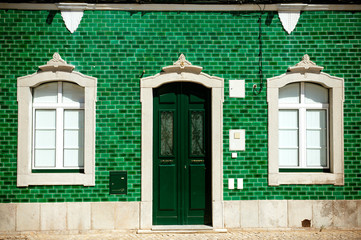 Old house with green tiles on facade - 35896246