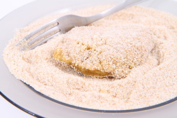Soy Meat being prepared in breadcrumbs
