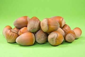 hazelnuts on the green background