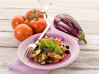 ratatouille over dish on white woodden table