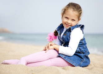 Portrait of cute young girl on the beach