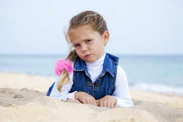 Portrait of cute young girl on the beach