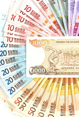 old greek drachma and euro cash notes. euro crisis concept