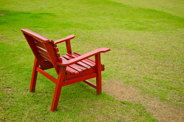 red armchair in grass land