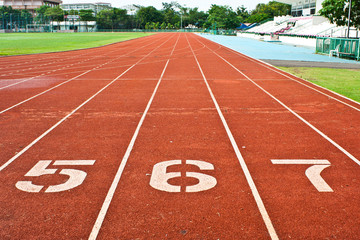 Fototapeta premium Number five six and seven on the start of a running track