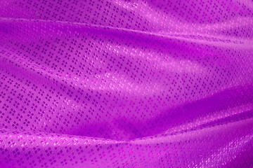 Fototapeta na wymiar Wave of purple textile