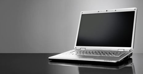 Modern laptop isolated on black background