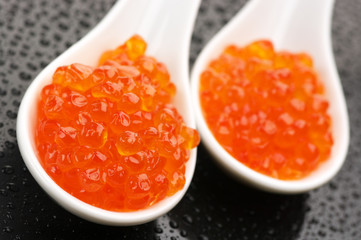 Salmon caviar in spoons