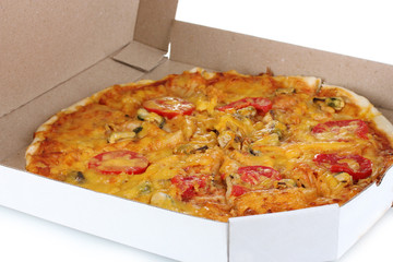 Delicious pizza with seafood in packaging isolated on white