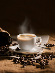 warm cup of coffee on brown background