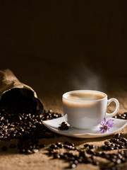 warm cup of coffee on brown background