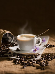 warm cup of coffee on brown background