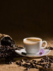 warm cup of coffee on brown background