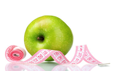 green apple and measuring tape isolated on white