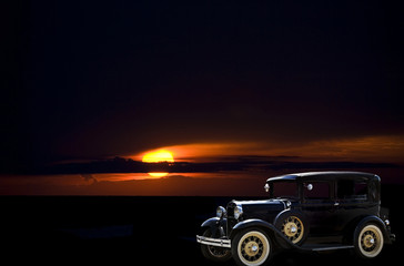 Obraz na płótnie Canvas vintage automobile with sunset