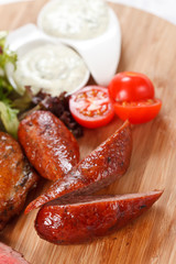 sausages on a wooden cutting board