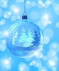 Fototapeta na wymiar Christmas ball on blue winter background.