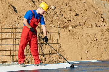 builder worker at roof insulation work