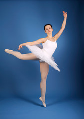 Ballet dancer posing in white tutu