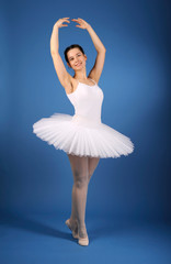 Ballet dancer posing in white tutu