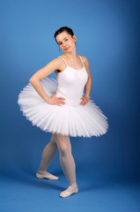Ballet dancer posing in white tutu