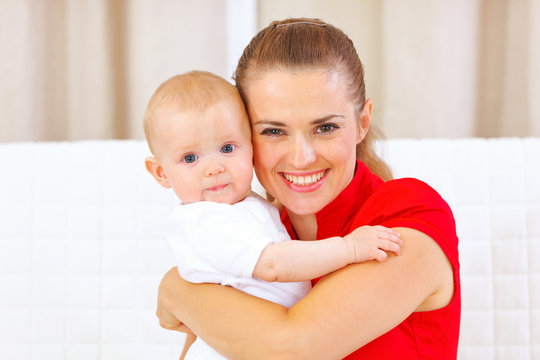 Portrait of lovely baby and young mother