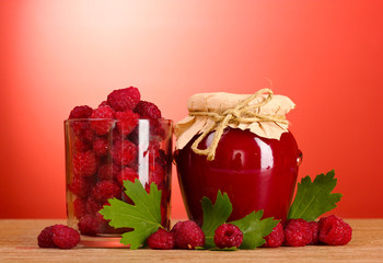 tasty fruit and berry jam on a wooden background