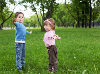 happy sister and brother outdoors