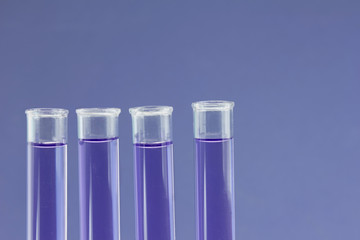 four blue test tube closeup