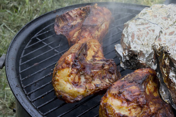smoked bbq chicken on grill
