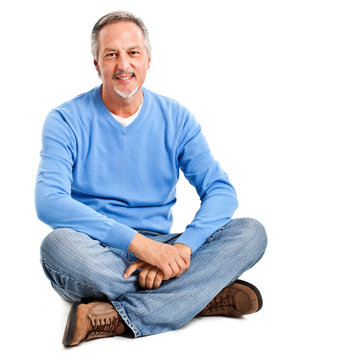 Mature Man Sitting On The Floor