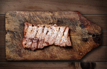 Pork ribs on wooden table.