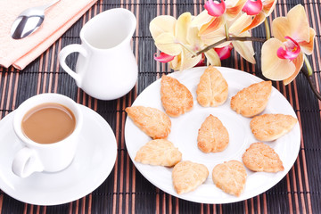Sugar cookies and a cup of coffee ..with cream