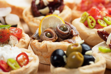 Anchovy rolls in bread cups