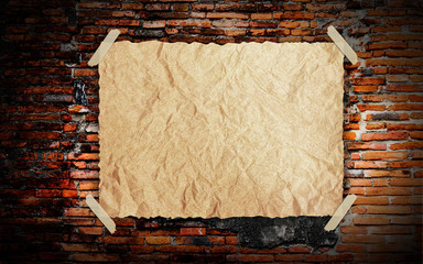 Grunge vintage old Brown paper on brickwall background