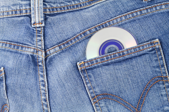 Blue jeans back pocket with a CD coming out