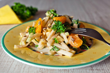 Kohlrabi salad on a wooden table