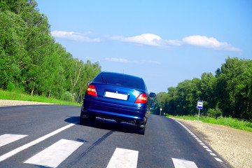 Blue car on the road