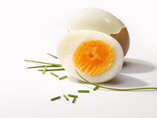 Two brown eggs one open