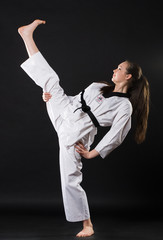 girl in kimono exercising karate kata