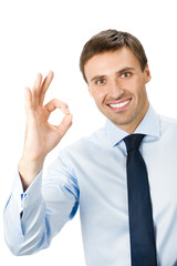 Businessman with okay gesture, isolated