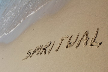 Fototapeta premium The word SPIRITUAL written in the sand