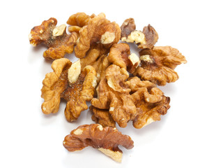 Crushed walnuts on white background