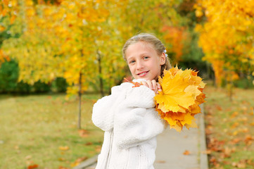 Girl with yellow leaves