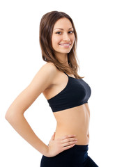 Smiling woman in fitness wear, isolated