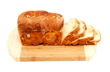 baked sugar bread in closeup on wooden cutting board