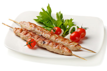 kebabs served with tomatoes