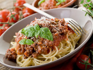 spaghetti bolognese with ragout sauce and parmesan cheese