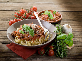 spaghetti bolognese with ragout sauce and parmesan cheese
